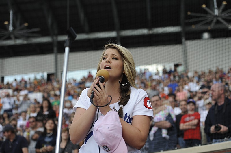 Singer and area native Lauren Alaina performs "God Bless America" during a 2011 baseball game between the Chattanooga Lookouts and the Tennessee Smokies.