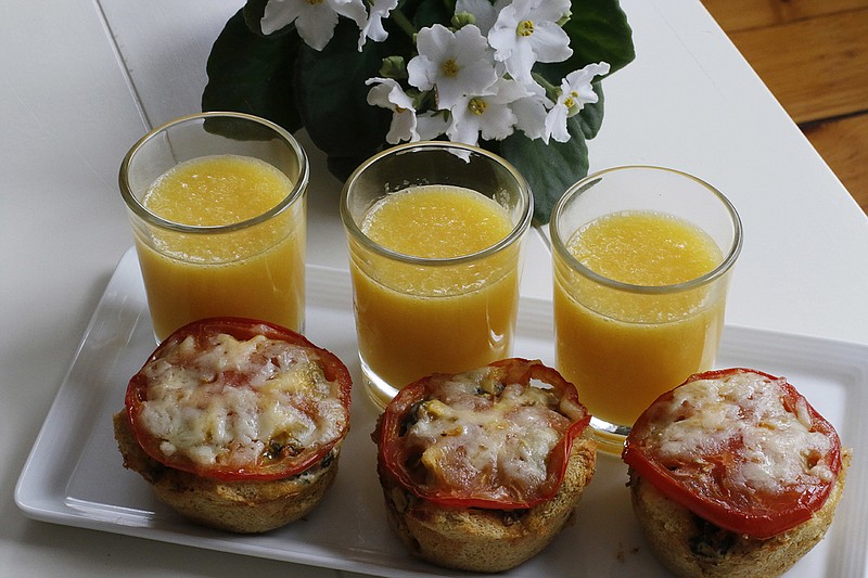 This April 4, 2016, photo shows easy overnight individual egg strata in Concord, N.H. These savory egg, meat and vegetable treats are ideal for a Mother's Day breakfast in bed because they are easy to eat and can be prepped the night before. (AP Photo/J.M. Hirsch)