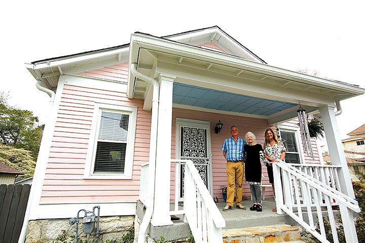 Graham Eischeid, Jill Eischeid and Fiona Eischeid, from left, pose for a photo in front of the house where Graham and Jill live in Chattanooga, Tennessee. (Staff photo by Erin O. Smith)