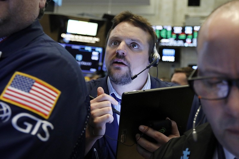 FILE - In this March 12, 2019, file photo, trader Michael Milano works on the floor of the New York Stock Exchange. The U.S. stock market opens at 9:30 a.m. EDT on Tuesday, April 23. (AP Photo/Richard Drew, File)

