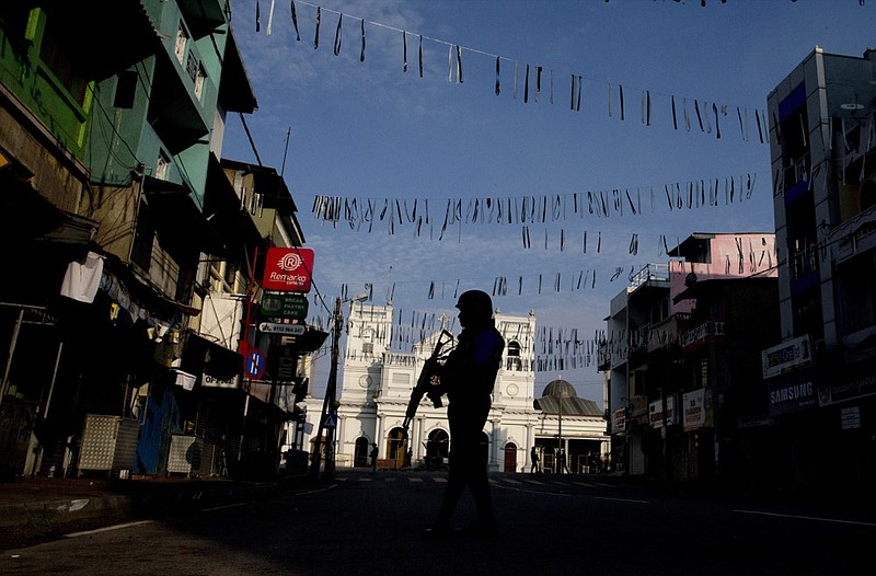 A security officer stands guard outside St. Anthony's Shrine where bombing was carried out on Easter Sunday, in Colombo, Sri Lanka, Wednesday, April 24, 2019. (AP Photo/Gemunu Amarasinghe)

