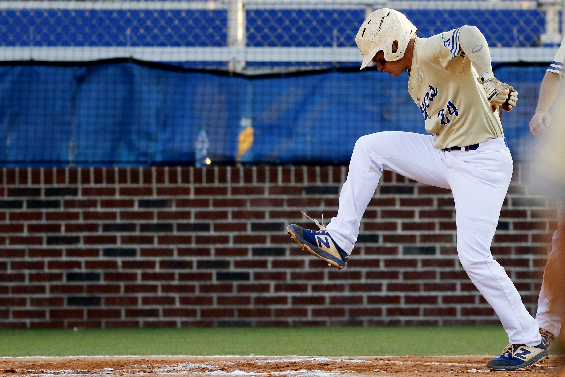Ringgold's Holden Tucker (24) emphatically stomps on home plate after hitting a solo home run during the second game of a double header in the first round of the GHSA playoffs against Cherokee Bluff at Bill Womack Field at Ringgold High School on Wednesday, April 24, 2019 in Ringgold, Ga.