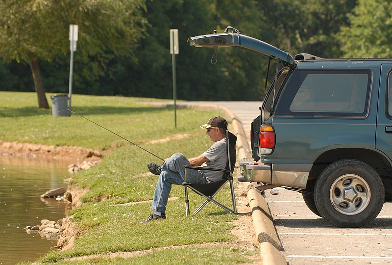 Mike Croucher fishes at the Jack Dickert Memorial Pond at Camp Jordan in East Ridge. Mr. Croucher, who fishes about every two weeks, says the pond has cat fish, brim and bass.