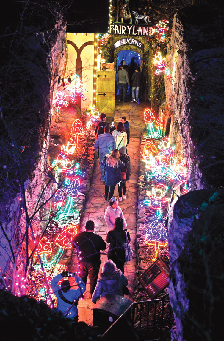 Visitors walk through lighted mushrooms and gnomes as they enter Fairyland at Rock City during the annual Christmas extravaganza.