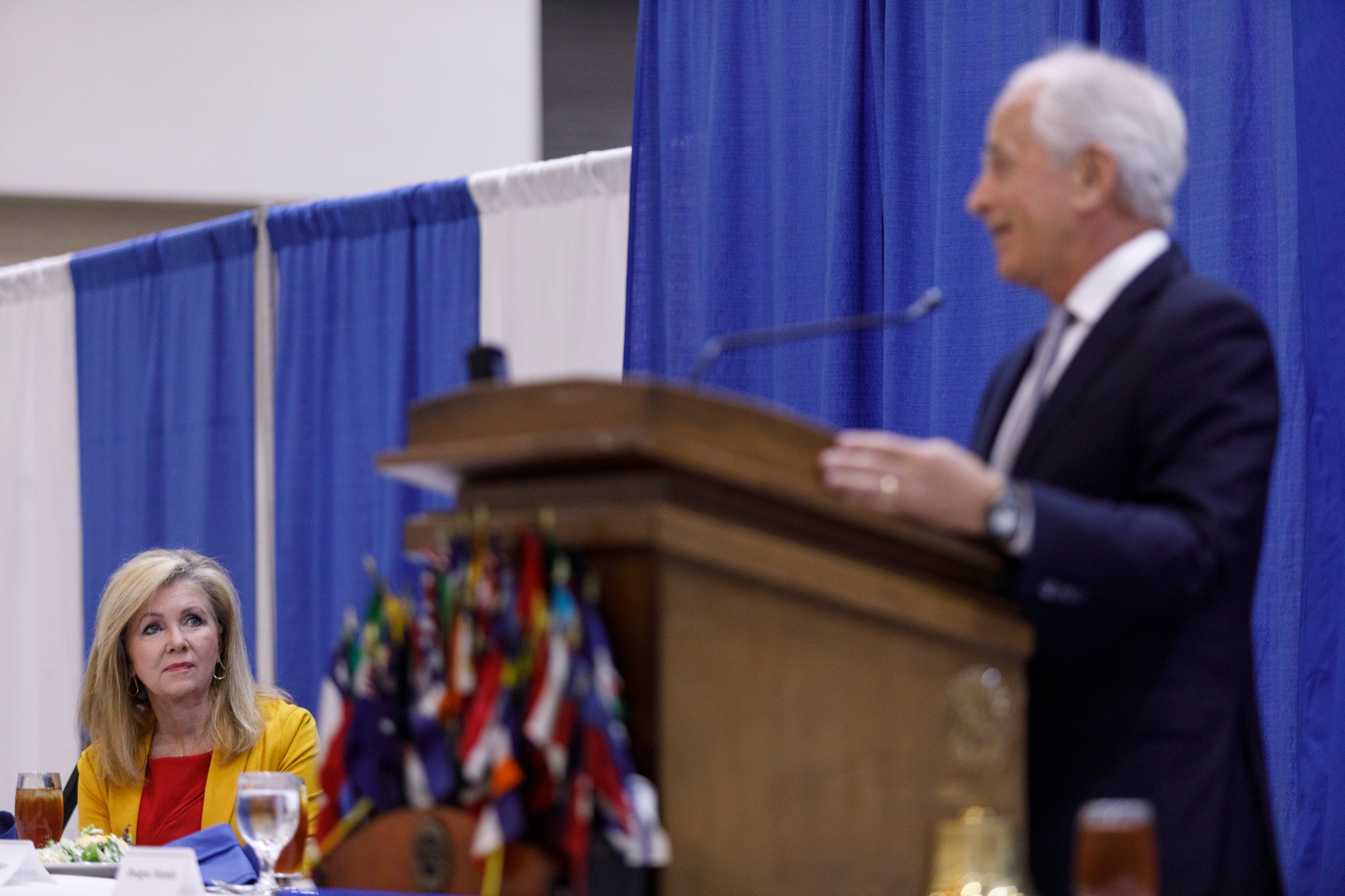 U.S. Sen. Marsha Blackburn listens as former Sen. Bob Corker introduces her during a Chattanooga Rotary Club luncheon at the Chattanooga Convention Center on Thursday, April 25, 2019, in Chattanooga, Tenn. Sen. Blackburn said during a speech that Tennesseeans are ready to move on from the Mueller investigation.
