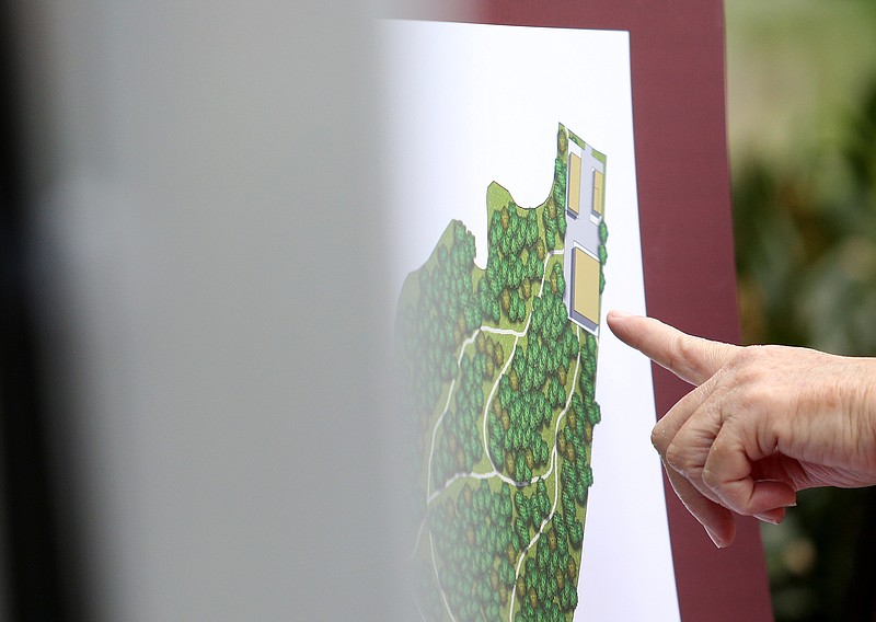 Attendees of a press conference Thursday, April 25, 2019 at East Ridge City Hall check out the renderings for the proposed professional soccer complex that is in the works for roughly 100 acres along Interstate 75 and Interstate 24 in East Ridge, Tennessee. Restaurants, apartments, hotels, condominiums and stores are expected to be built around the 5,500-seat facility.