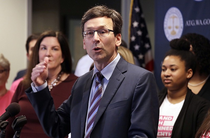 FILE - In this Feb. 25, 2019 file photo, Washington state Attorney General Bob Ferguson speaks at a news conference announcing a lawsuit challenging the Trump administration's Title X "gag rule" in Seattle. A federal judge in Washington state on Thursday, April 25, 2019, will hear arguments in two cases against new Trump administration rules that could cut off federal funding for health care providers who refer patients for an abortion. (AP Photo/Elaine Thompson, File)

