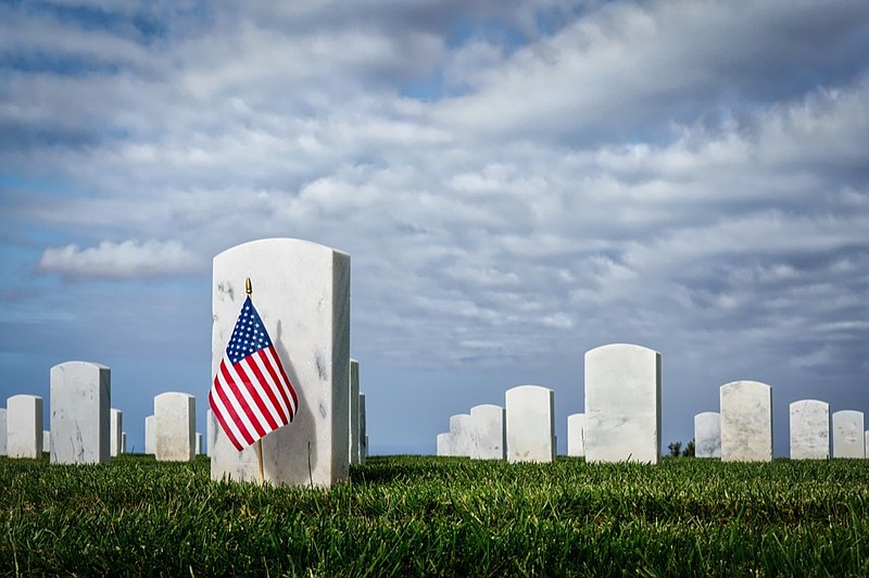 
A flag on a grave at a southern California cemetery. grave cemetery tile / Getty Images