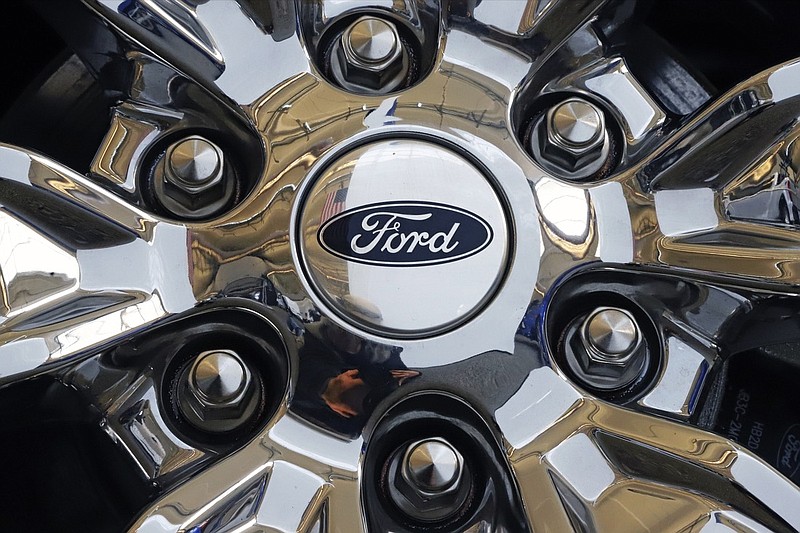 In this Feb. 14, 2019, file photo a wheel on a 2019 Ford Expedition 4x4 is displayed at the 2019 Pittsburgh International Auto Show in Pittsburgh. Ford Motor Co. reports earns on Thursday, April 25. (AP Photo/Gene J. Puskar, File)