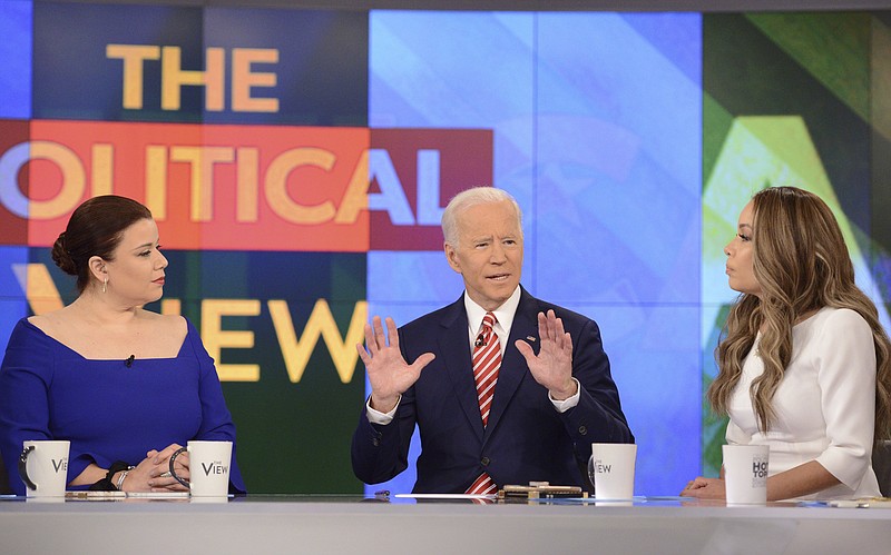 This image released by ABC shows Democratic presidential candidate Joe Biden, center, with co-hosts, Ana Navarro, left, and Sunny Hostin during an appearance on "The View," Friday, April 26, 2019. (Lorenzo Bevilaqua/ABC via AP)