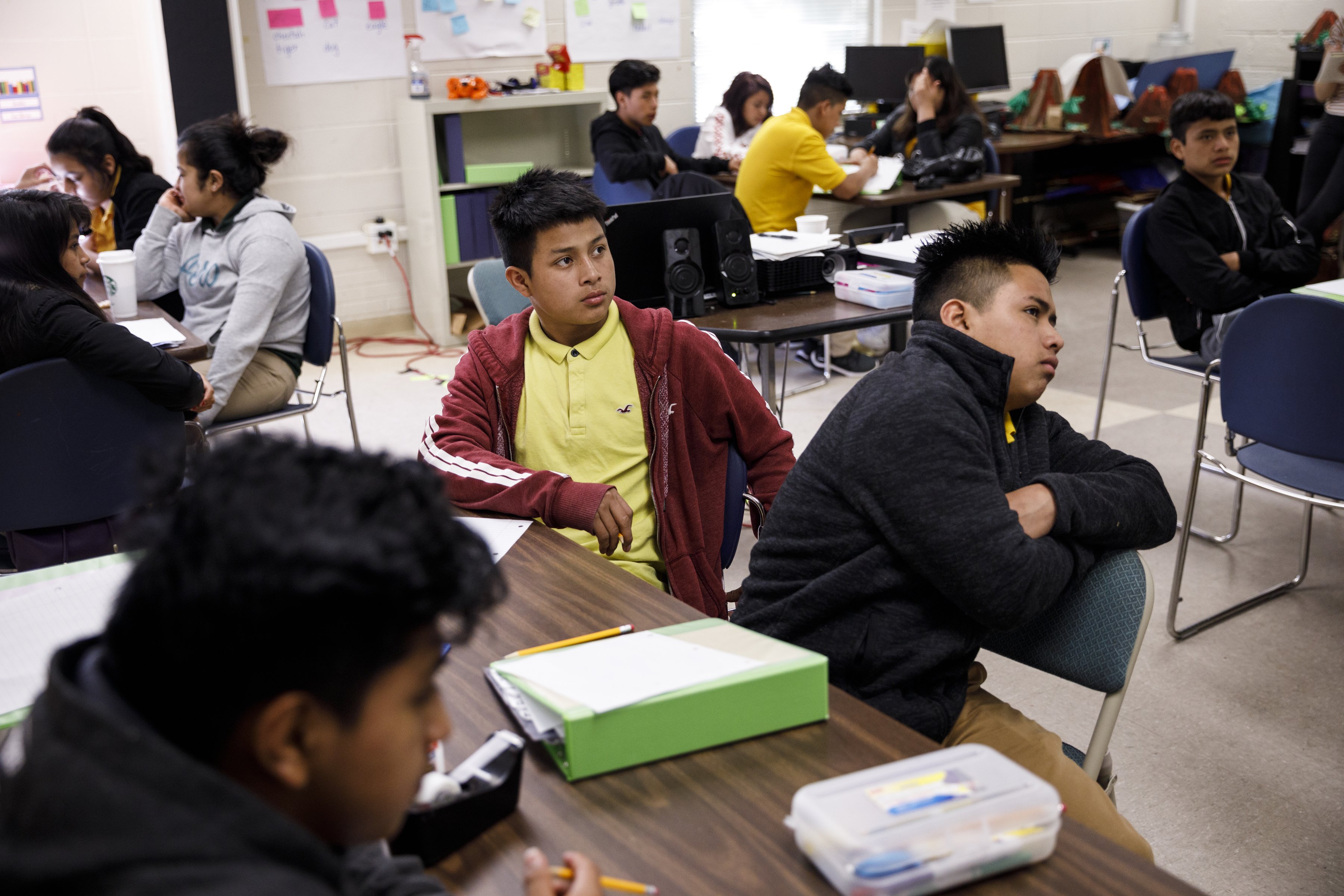 Students Deyner, left, and Amilcar listen during a NewComer Academy class at Howard School on Tuesday, April 23, 2019, in Chattanooga, Tenn. Howard has launched NewComer Academy to help acclimate new Hispanic students, who comprised nearly 60% of the school's 2019 freshmen class.