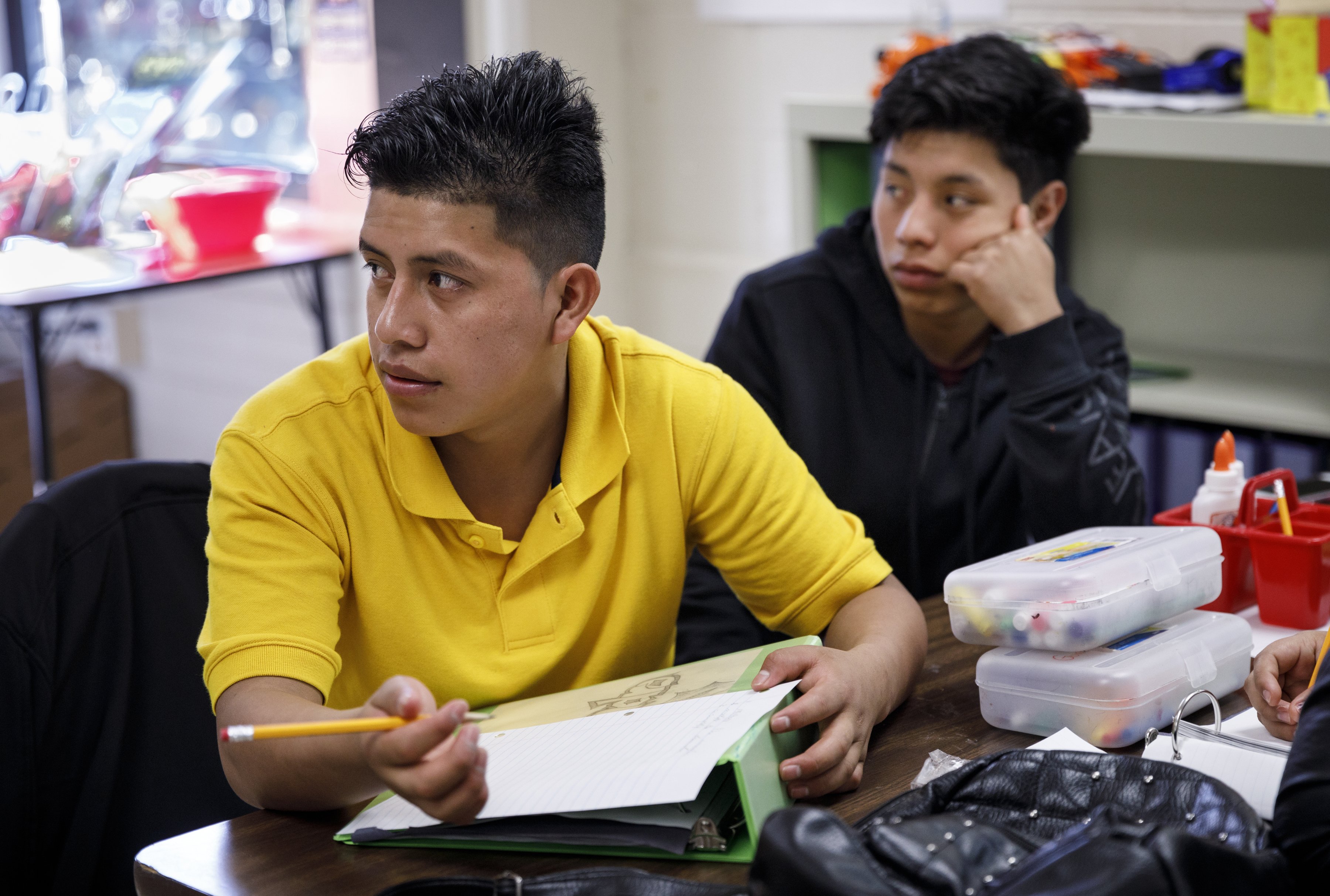 Students Alejandro, left, and Mycol listen during a NewComer Academy class at Howard School on Tuesday, April 23, 2019, in Chattanooga, Tenn. Howard has launched NewComer Academy to help acclimate new Hispanic students, who comprised nearly 60% of the school's 2019 freshmen class.