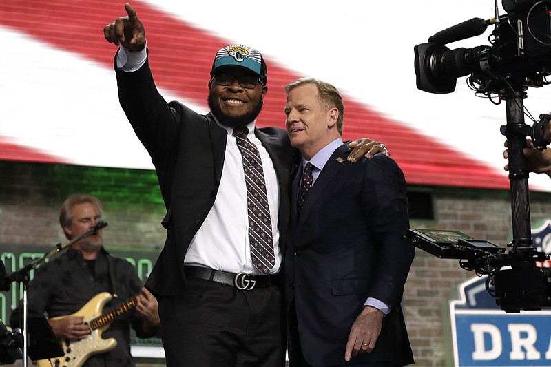 Florida's Jawaan Taylor poses with NFL commissioner Roger Goodell after the Jacksonville Jaguars selected Taylor in the second round of the draft Friday night in Nashville.