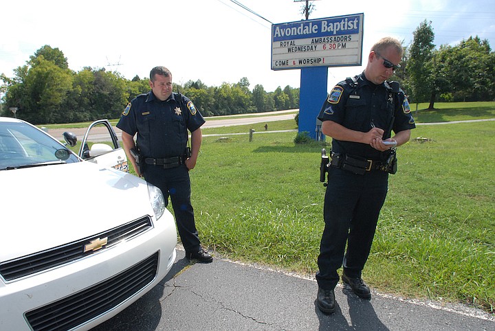 Eddie Sledge, left, is pictured in this file photo. Sledge, a 22-year veteran of the Hamilton County Sheriff's Office died Saturday night (Staff Photo by Allison Kwesell).