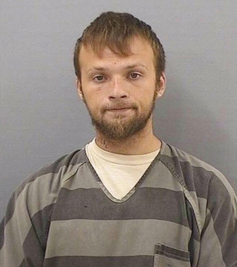 This undated booking photo provided by the Tennessee Bureau of Investigation shows Michael Cummins. Authorities say Cummins, 25, was taken into custody Saturday, April 27, 2019, in the investigation into several bodies found in two homes near Westmoreland, Tenn. Authorities say when the suspect Cummins was captured, he produced multiple weapons, prompting an officer to shoot him. Cummins was taken to a local hospital. (Tennessee Bureau of Investigation via AP)
