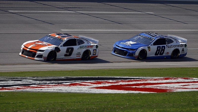 Chase Elliott races ahead of Alex Bowman on Sunday at Talladega Superspeedway.