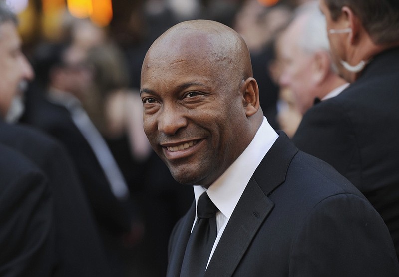 FILE - In this Feb. 24, 2008 file photo, director John Singleton arrives at the 80th Academy Awards in Los Angeles. Oscar-nominated filmmaker John Singleton has died at 51, according to statement from his family, Monday, April 29, 2019. He died Monday after suffering a stroke almost two weeks ago. (AP Photo/Chris Pizzello, File)

