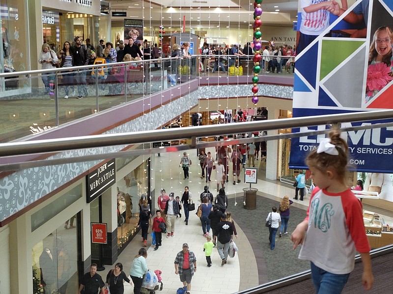 Both upper and lower levels are crowded with shoppers on Black Friday inside Hamilton Place Mall.