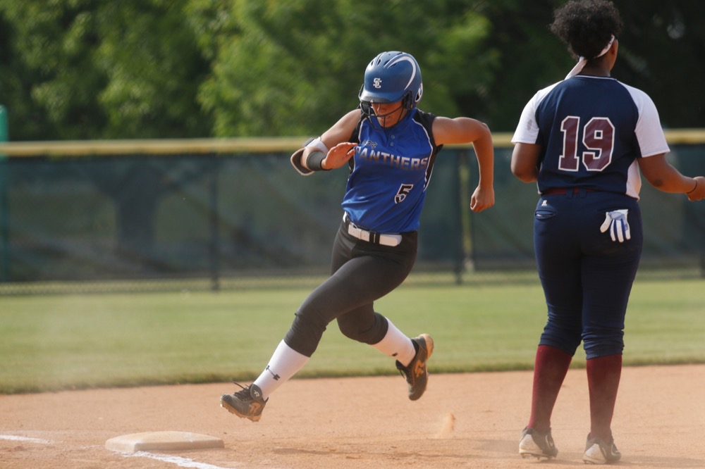 Sale Creek runner Shelby Sullivan rounds third base and CSAS infielder Maliyah Mayes during their prep softball game at Warner Park on Tuesday, April 30, 2019, in Chattanooga, Tenn.