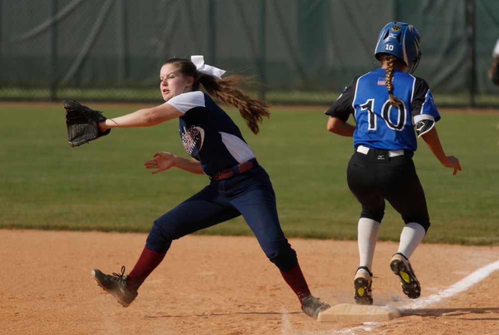 Sale Creek runner Hannah Hall reaches first ahead of the throw to CSAS first baseman Ashley Twitty during their prep softball game at Warner Park on Tuesday, April 30, 2019, in Chattanooga, Tenn.