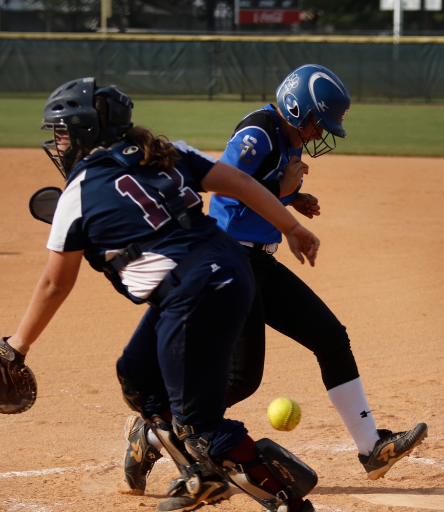 Sale Creek runner Shelby Sullivan crosses home plate on a wild throw to CSAS catcher Cydney Kapperman during their prep softball game at Warner Park on Tuesday, April 30, 2019, in Chattanooga, Tenn.