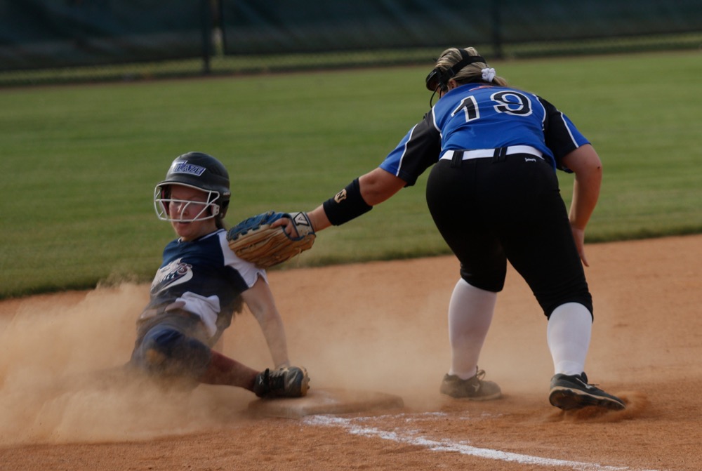 CSAS runner Ashley Twitty slides into third base around a tag by Sale Creek third baseman Kristen Sharp during their prep softball game at Warner Park on Tuesday, April 30, 2019, in Chattanooga, Tenn.