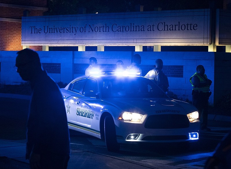 Police secure the main entrance to UNC Charlotte after a fatal shooting at the school, Tuesday, April 30, 2019, in Charlotte, N.C. (AP Photo/Jason E. Miczek)

