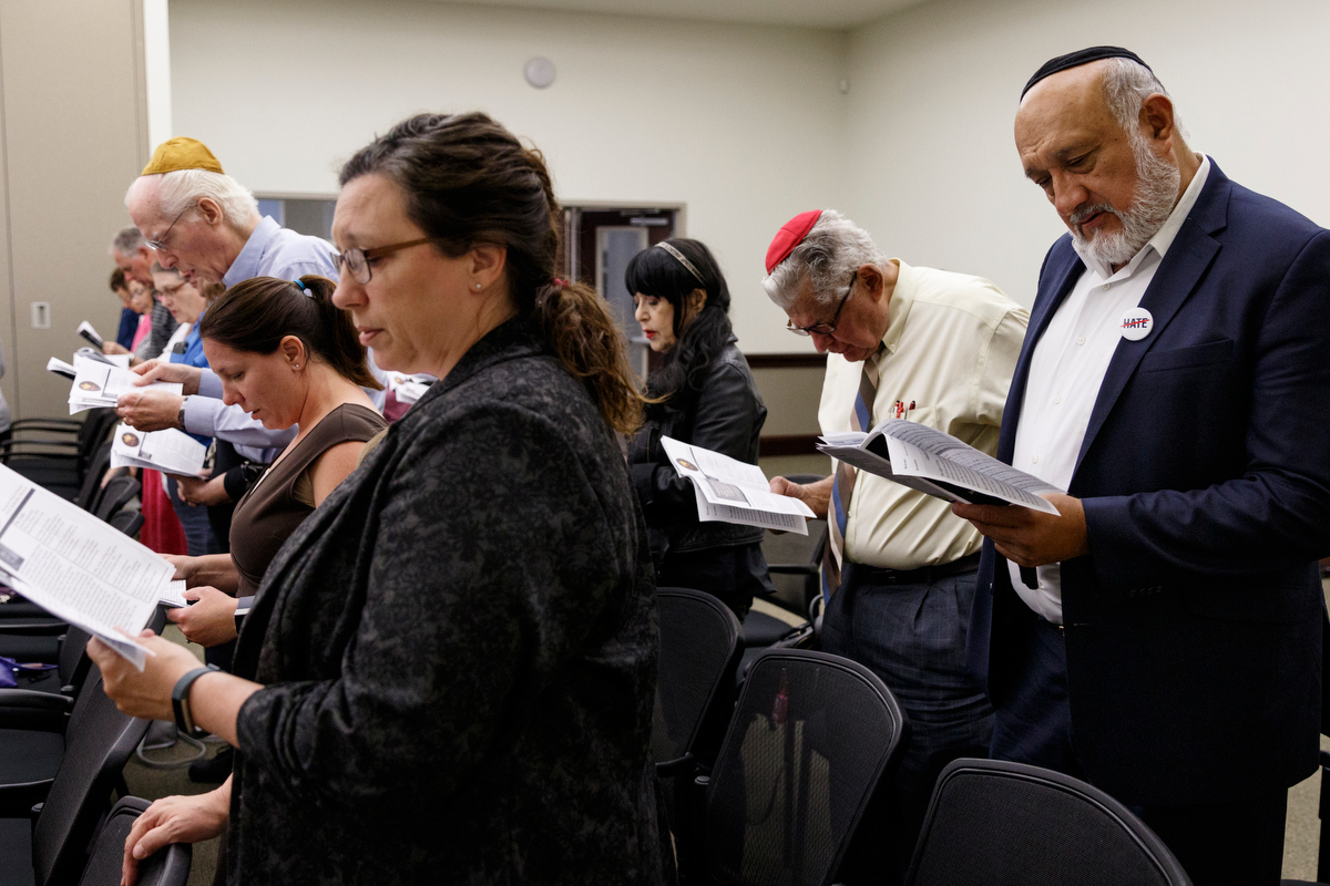 People pray during a Yom HaShoah ceremony at the Jewish Cultural Center on Wednesday, May 1, 2019, in Chattanooga, Tenn. The tradition is held to honor the memories of the six million Jews killed during the Holocaust between 1941 and 1945.