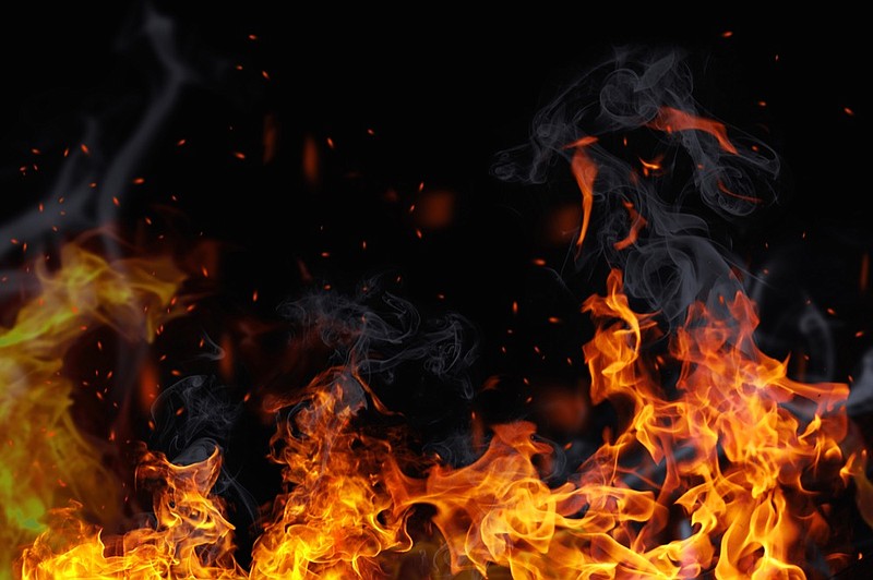 Texture of fire on a black background. fire tile black / Getty Images