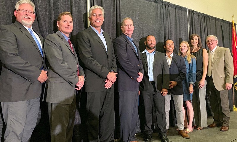 
The 2019 Torch Award Winners and honorable mentionees take a picture with the Better Business Bureau President Jim Winsett at the organization's annual meeting Wednesday. There were 15 businesses nominated for the award this year. / Staff photo by Allison Shirk Collins
