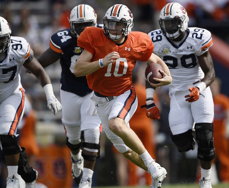 Auburn quarterback and early enrollee Bo Nix looks for running room during last month's A-Day game at Jordan-Hare Stadium.