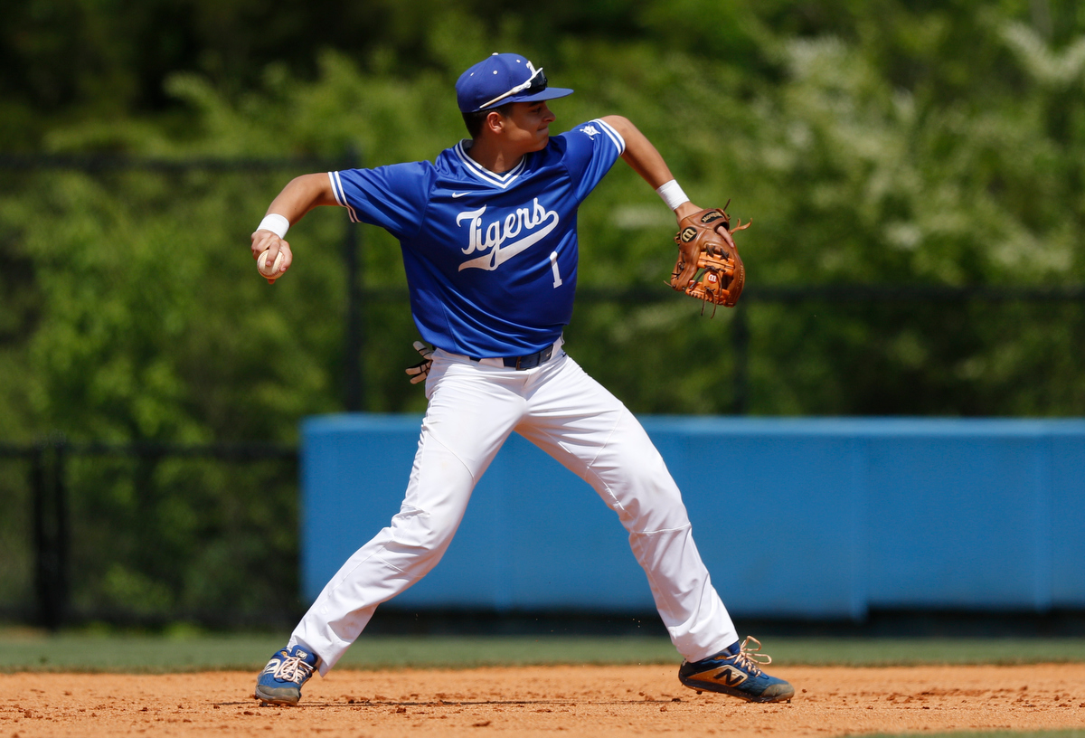 Ringgold second baseman Colin Mountjoy makes the throw to first during the continuation of the Tigers' lightning-delayed game against Hart County at Ringgold High School on Thursday, May 2, 2019, in Ringgold, Ga.