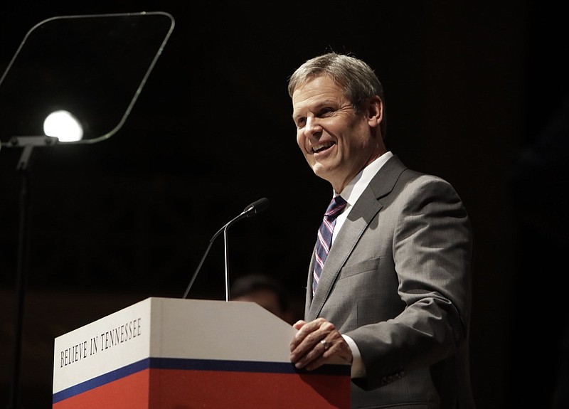 FILE - In this Friday, Jan. 18, 2019 file photo, Tennessee Gov.-elect Bill Lee takes part in a walk-through for his inauguration in War Memorial Auditorium in Nashville, Tenn. Gov. Bill Lee has signed legislation that would likely make Tennessee the first to fine voter registration groups for turning in too many incomplete signup forms. It drew an immediate federal lawsuit. Tennessee's NAACP chapter and other voter registration groups sued after Lee signed the bill Thursday, May 2, 2019 backed by Republican Secretary of State Tre Hargett. Groups submitting 100-plus incomplete registrations over a year could be fined. (AP Photo/Mark Humphrey, File)

