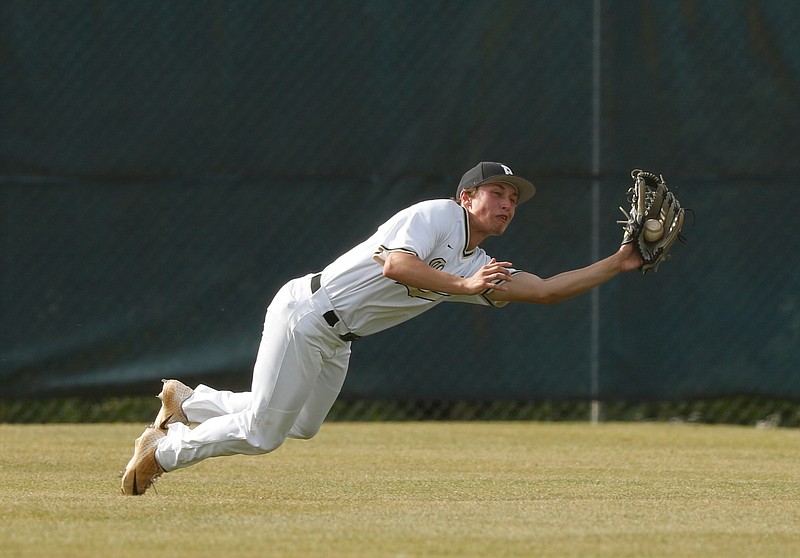 Bradley Central center fielder Caden Sherlin makes a diving catch against Ooltewah in a District 5-AAA tournament game Friday at Soddy-Daisy.