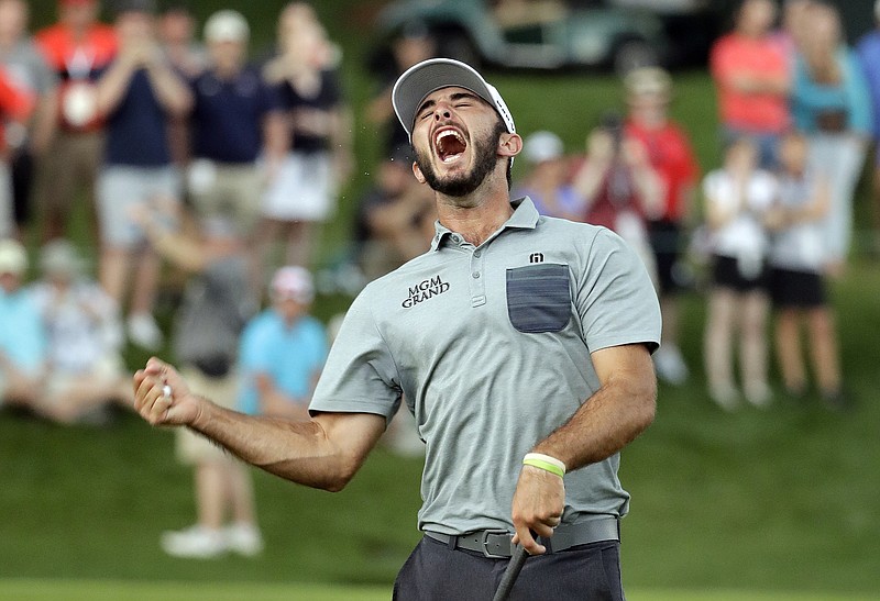 Max Homa celebrates after winning the Wells Fargo Championship on Sunday at Quail Hollow Club in Charlotte, N.C. Homa closed with a 67 for a three-shot victory over Joel Dahmen.