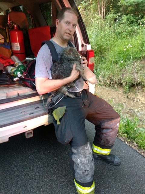 Photo contributed by Tri-Community Volunteer Fire Department Deputy Chief Danny Hague
Tri-Community Volunteer firefighter Lt. Brent Seifert administers oxygen to a dog saved from a burning home on Sunday, May 5, 2019.