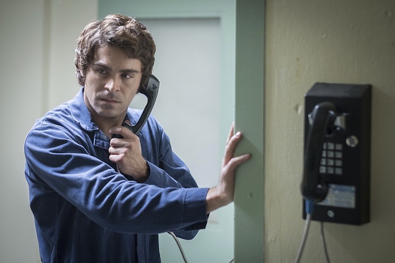 This image released by Netflix shows Zac Efron in a scene from "Extremely Wicked, Shockingly Evil, and Vile." (Brian Douglas/Netflix via AP)