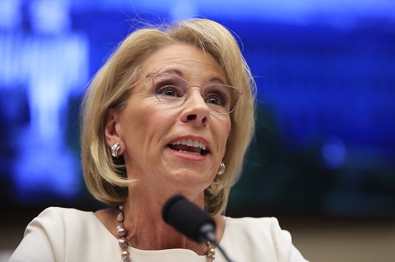 In this April 10, 2019, file photo, Education Secretary Betsy DeVos testifies before the House Education and Labor Committee at a hearing on 'Examining the Policies and Priorities of the U.S. Department of Education' on Capitol Hill in Washington. Education, it s safe to say, is not President Donald Trump s top priority. Instead, he entrusts that realm to Education Secretary Betsy DeVos, who after two years has emerged as one of the most polarizing figures in the Cabinet but also one of its most enduring members. (AP Photo/Manuel Balce Ceneta, File)
