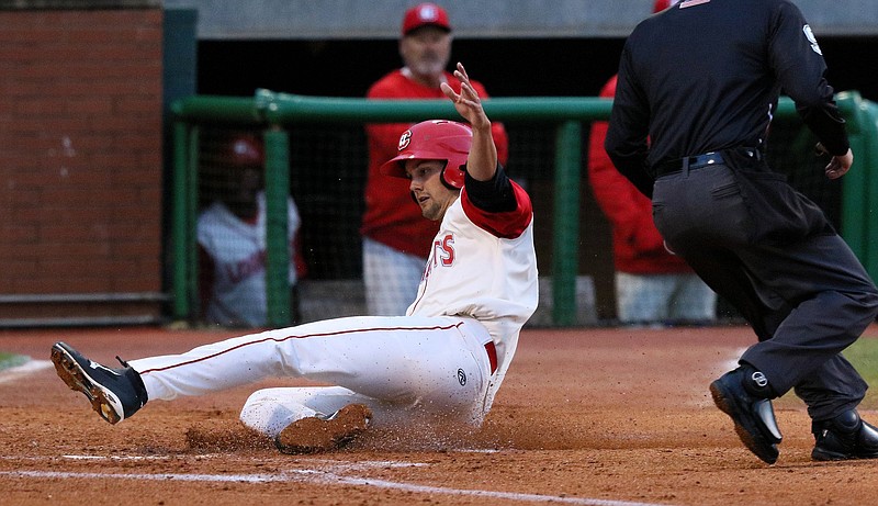 Lookouts pitcher Scott Moss scores on a RBI during a game earlier this season at AT&T Field. The Lookouts play the Tennessee Smokies tonight and Friday, then the Pensacola Blue Wahoos come to town Saturday through Wednesday.