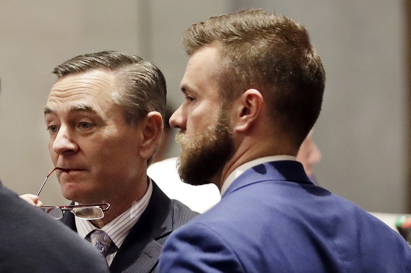 In this May 2, 2019, file photo, House Speaker Glen Casada, R-Franklin, left, talks with Cade Cothren, right, his chief of staff, during a House session in Nashville, Tenn. Cothren has resigned amid allegations of racist and sexually explicit texts. (AP Photo/Mark Humphrey, File)