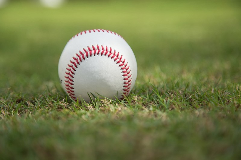 Baseball on green grass baseball tile / Getty Images
