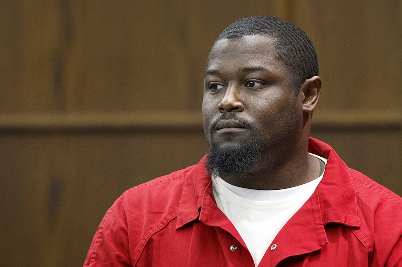 Unjolee Moore makes his way into Judge Don Poole's courtroom in the Hamilton County-Chattanooga Courts Building on Monday, Aug. 13, 2018 in Chattanooga, Tenn. Moore was appealing his 2010 murder conviction.