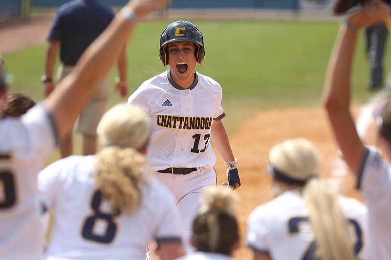 UTC's Emma Surdivant, center, celebrates with teammates as she crosses the plate after hitting a home run during the Mocs' win against Furman in the first round of the SoCon softball tournament Wednesday at Frost Stadium. Down 4-0 early, UTC rallied for a 9-5 victory.