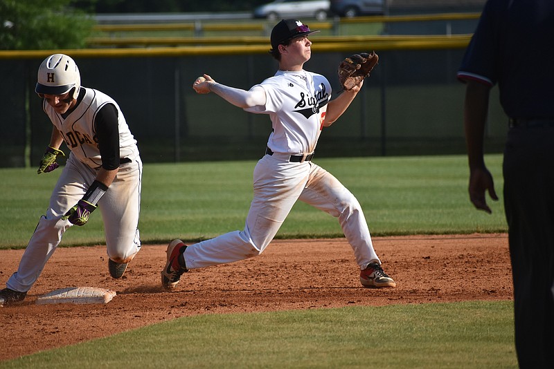 Signal Mountain's Brennen Weigert attempts to turn a double play against Hixson. The Eagles won their third consecutive game against the Wildcats to win the District 6-AA championship Wednesday.