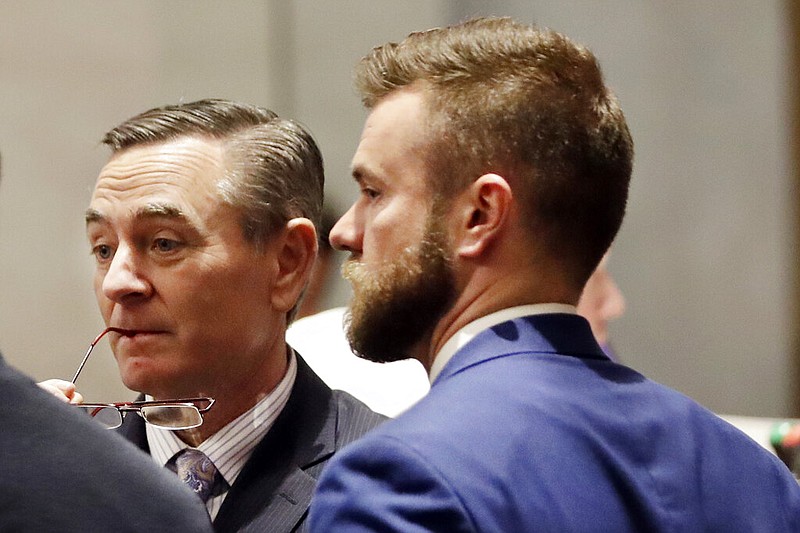 FILE - In this May 2 file photo, House Speaker Glen Casada, R-Franklin, left, talks with Cade Cothren, right, his former chief of staff, during a House session. Cothren resigned Tuesday amid allegations of racist and sexually explicit texts. (AP Photo/Mark Humphrey, File)