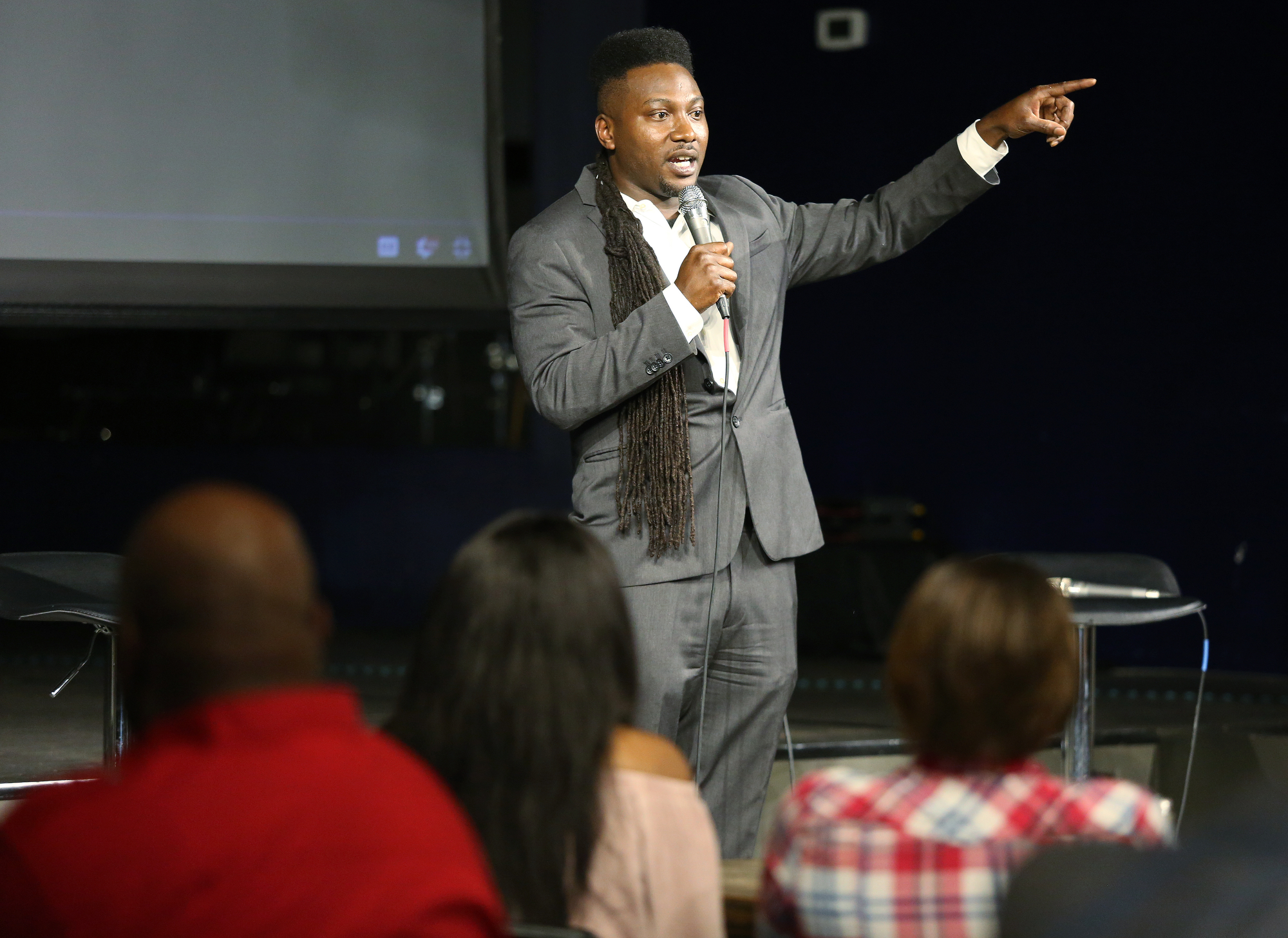Maurice McDowell Jr. of Lil Mo Films introduces Jamaal Hicks, the executive producer for the documentary "32," during viewing and panel discussion at Camp House Thursday, May 9, 2019 in Chattanooga, Tennessee. The documentary is about a 32-man federal roundup that occurred in 2013. McDowell Jr. and Hicks worked to produce the documentary in order to foster conversation about injustices in the legal system.