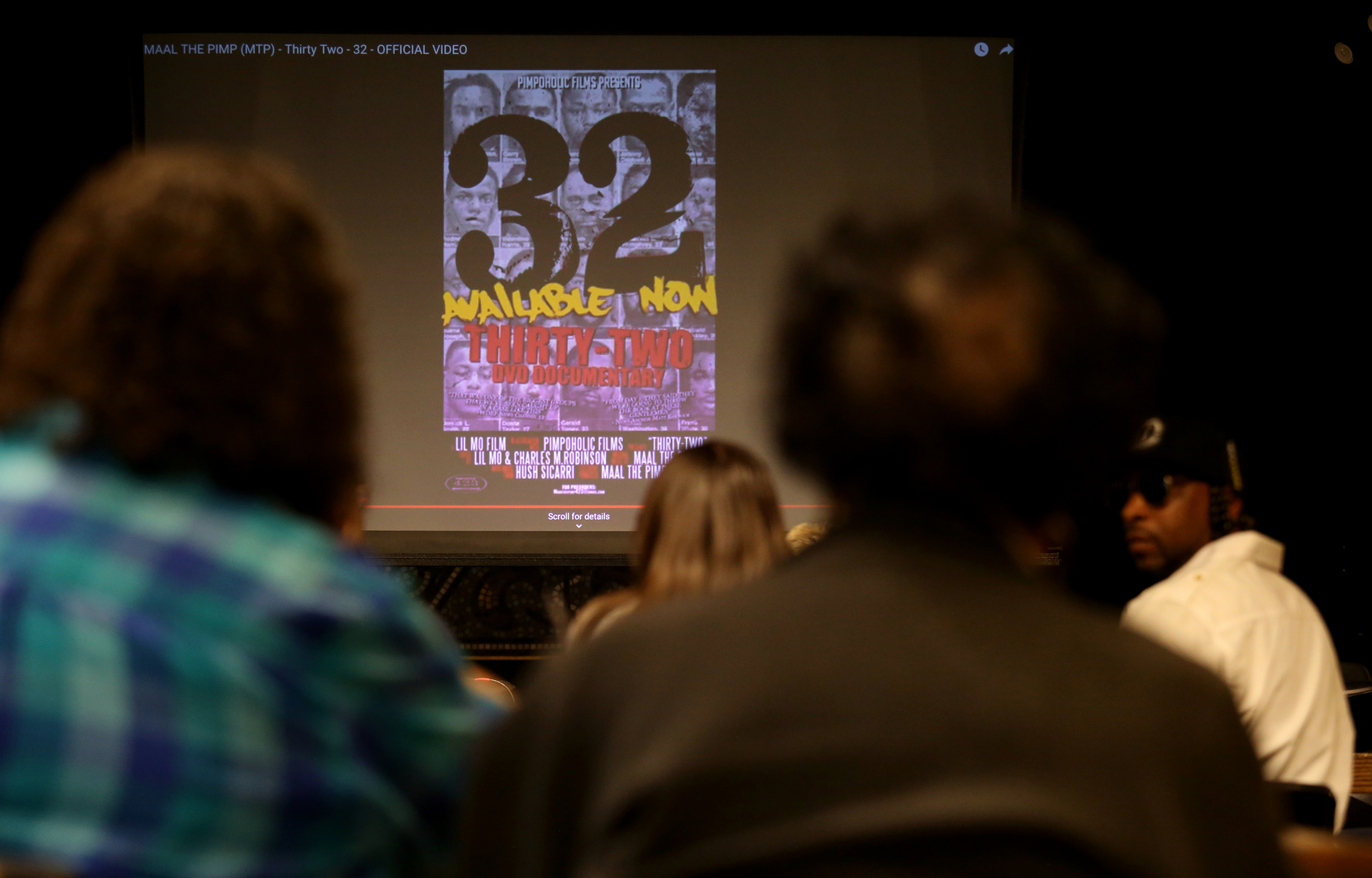 Attendees of a panel discussion get to see short clips from the documentary "32" at Camp House Thursday, May 9, 2019 in Chattanooga, Tennessee. The documentary is about a 32-man federal roundup that occurred in 2013 in which 32 black males were arrested and primarily charged with drug-related offenses.