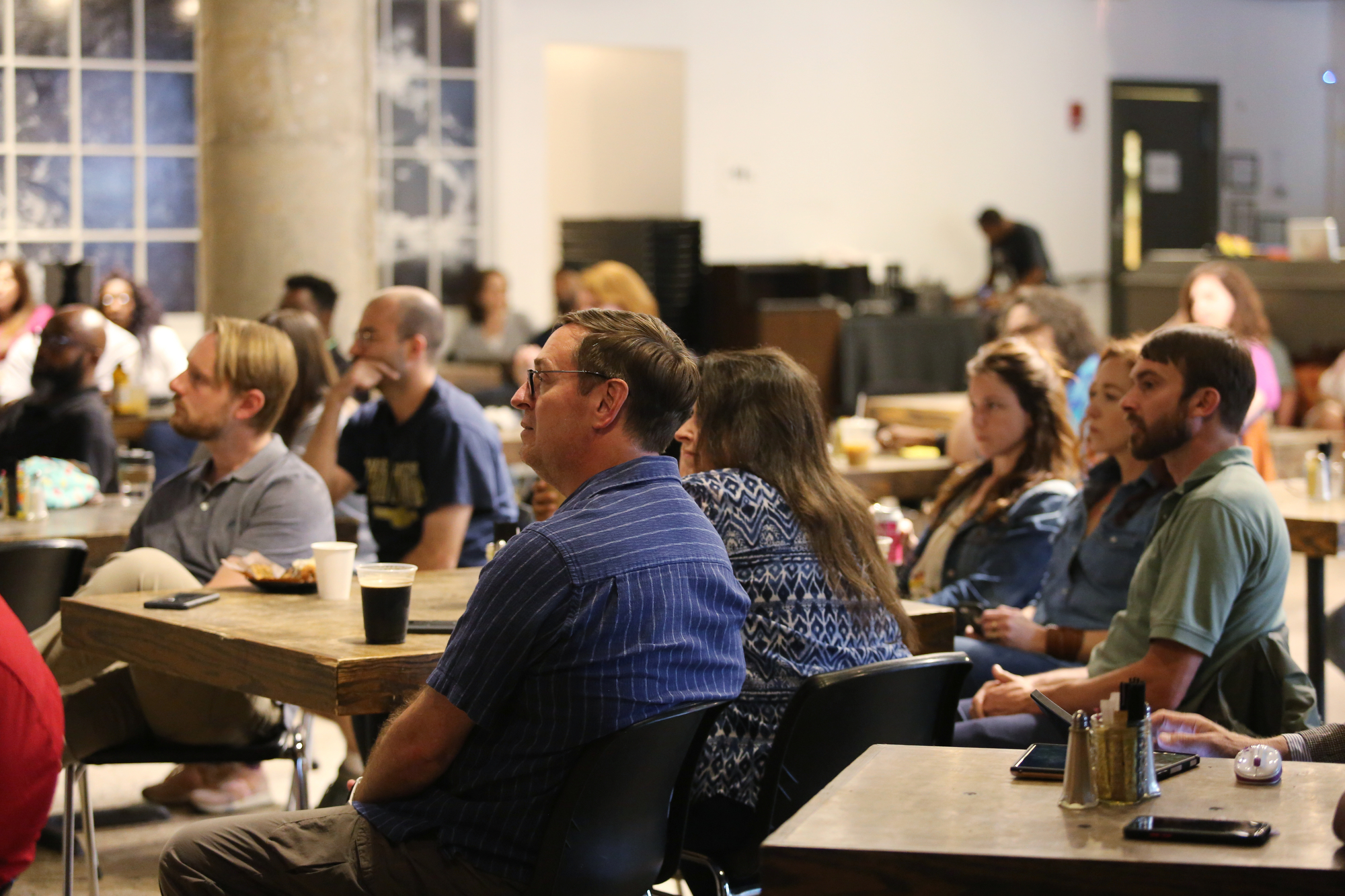 Camp House is filled with individuals listening to a panel discussion during a viewing of the documentary "32" at Camp House Thursday, May 9, 2019 in Chattanooga, Tennessee. The documentary is about a 32-man federal roundup that occurred in 2013.