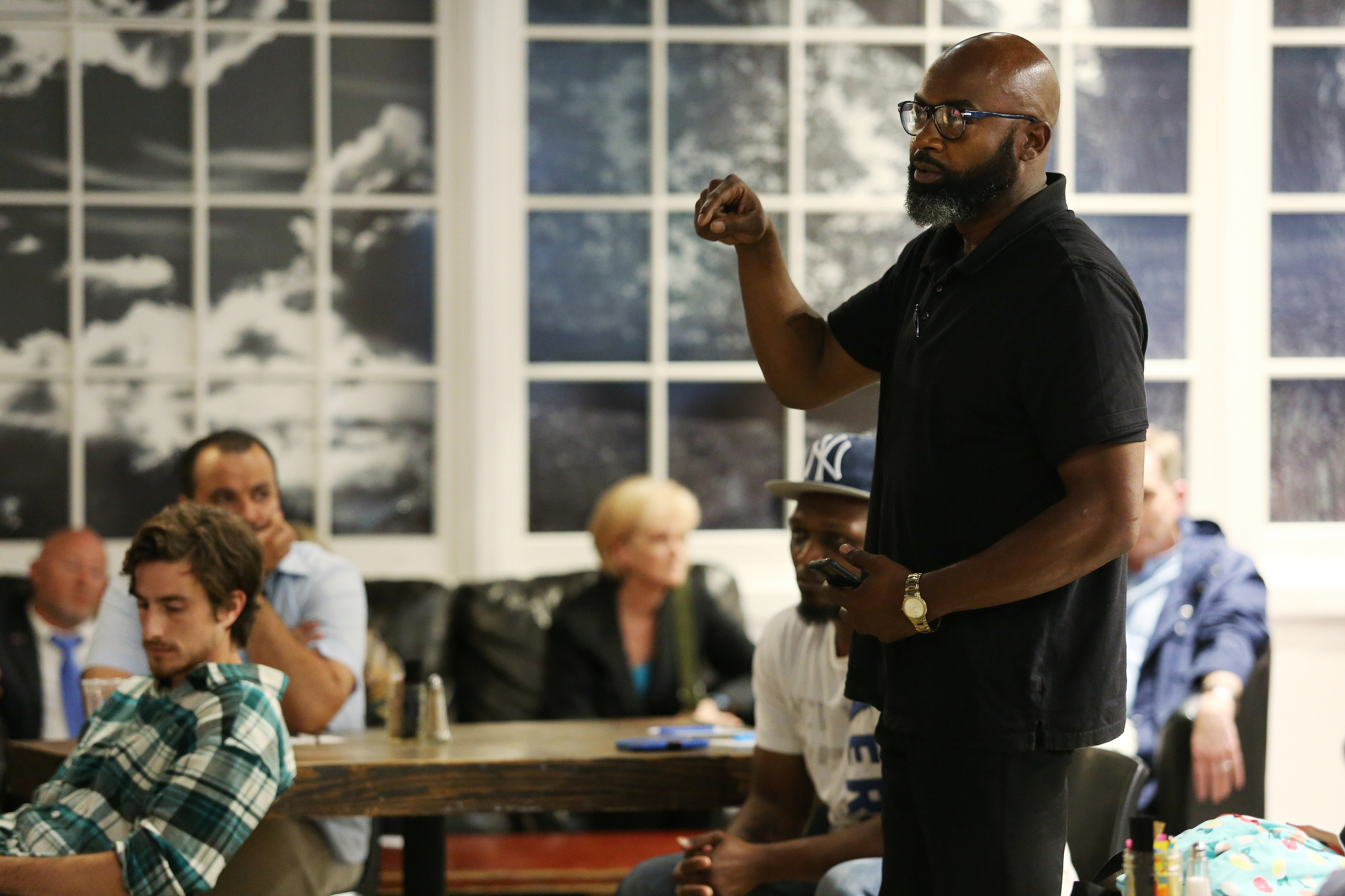 Ezzard Robinson, a community organizer and social activist, asks questions to Neal Pinkston, the Hamilton County District Attorney, during panel discussion and viewing of the documentary of "32" at Camp House Thursday, May 9, 2019 in Chattanooga, Tennessee. Robinson asked Pinkston about his large case against the Athens Park Bloods, where 54 people are charged with committing crimes on the groupճ behalf.