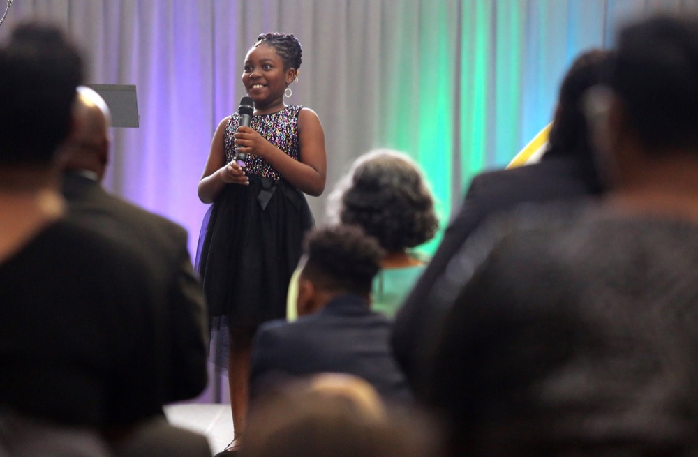 LeAyla Johnson of Barger Academy reacts as she gets a standing ovation after reading her poem "Hey Me!" during the OZcars Gala Friday, May 10, 2019 at Unum in Chattanooga, Tennessee. The event was held for the Opportunity Zone schools in Hamilton County to celebrate educators who have gone above and beyond to help students succeed.